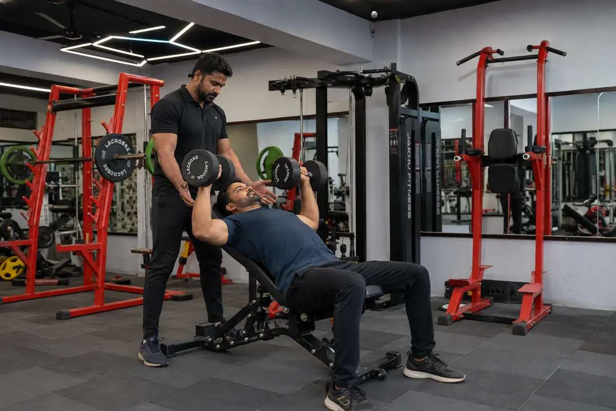 Members training with a trainer at Arya Fitness Gym, Harit Vihar, Burari