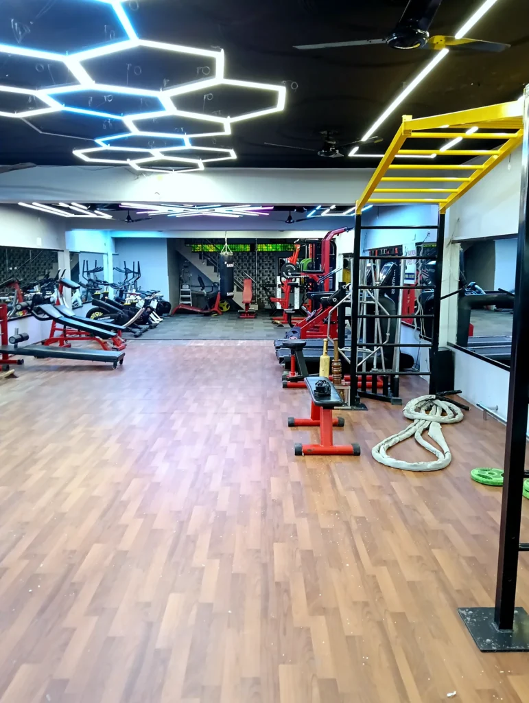Spacious main workout floor with strength and cardio equipment at Arya Fitness